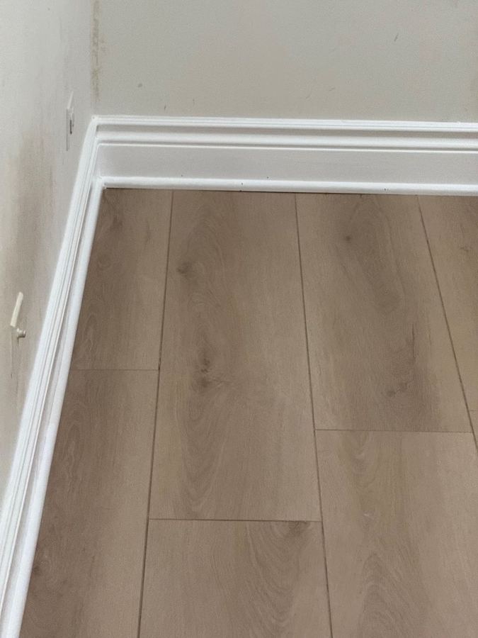 Up close: clean edges at the baseboard